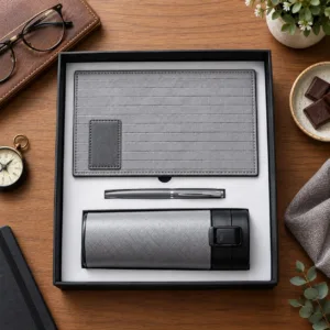 Grey corporate gift set with textured organizer, pen and flask in black box